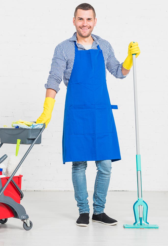Man with a blue smock and cleaning supplies